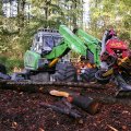 Menzi Muck "Schreit-Harvester" mit  Woody H50-Aggregat